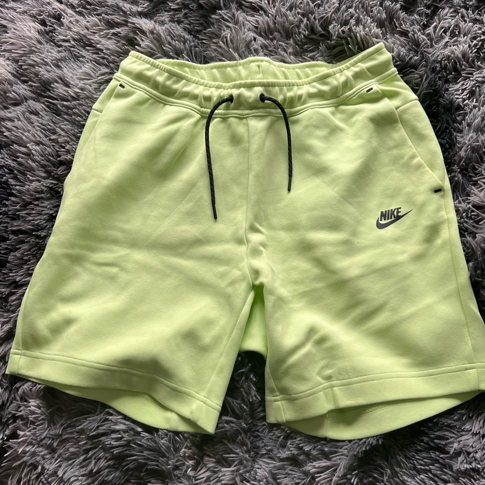 Green Nike tech pants